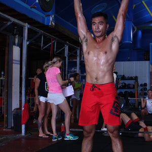 Box2Beach Board Shorts red in action