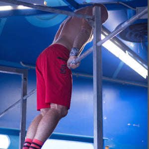 Box2Beach Board Shorts red in action